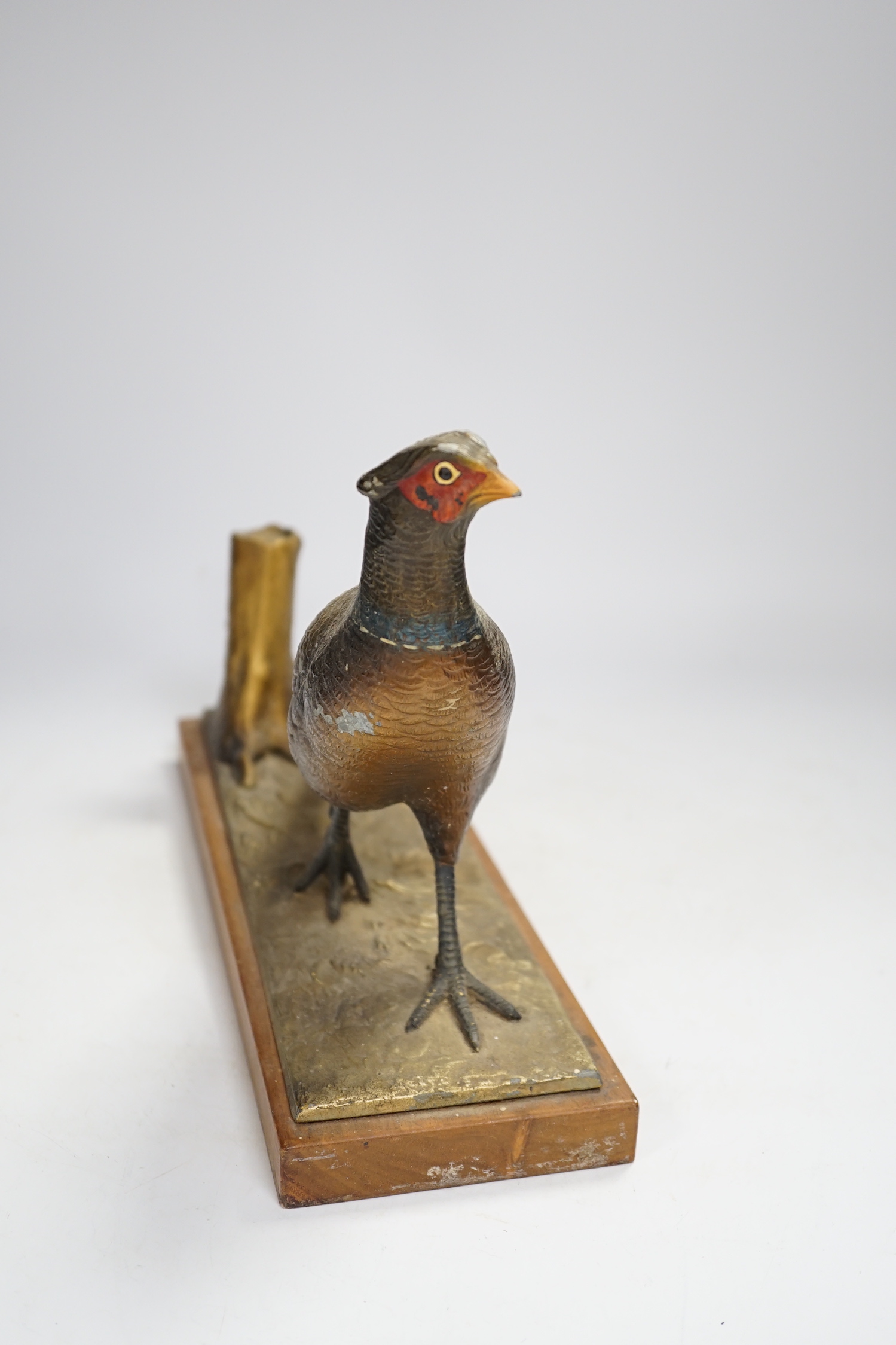 A cold painted spelter table striker, in the form of a pheasant, 31.5cm wide
